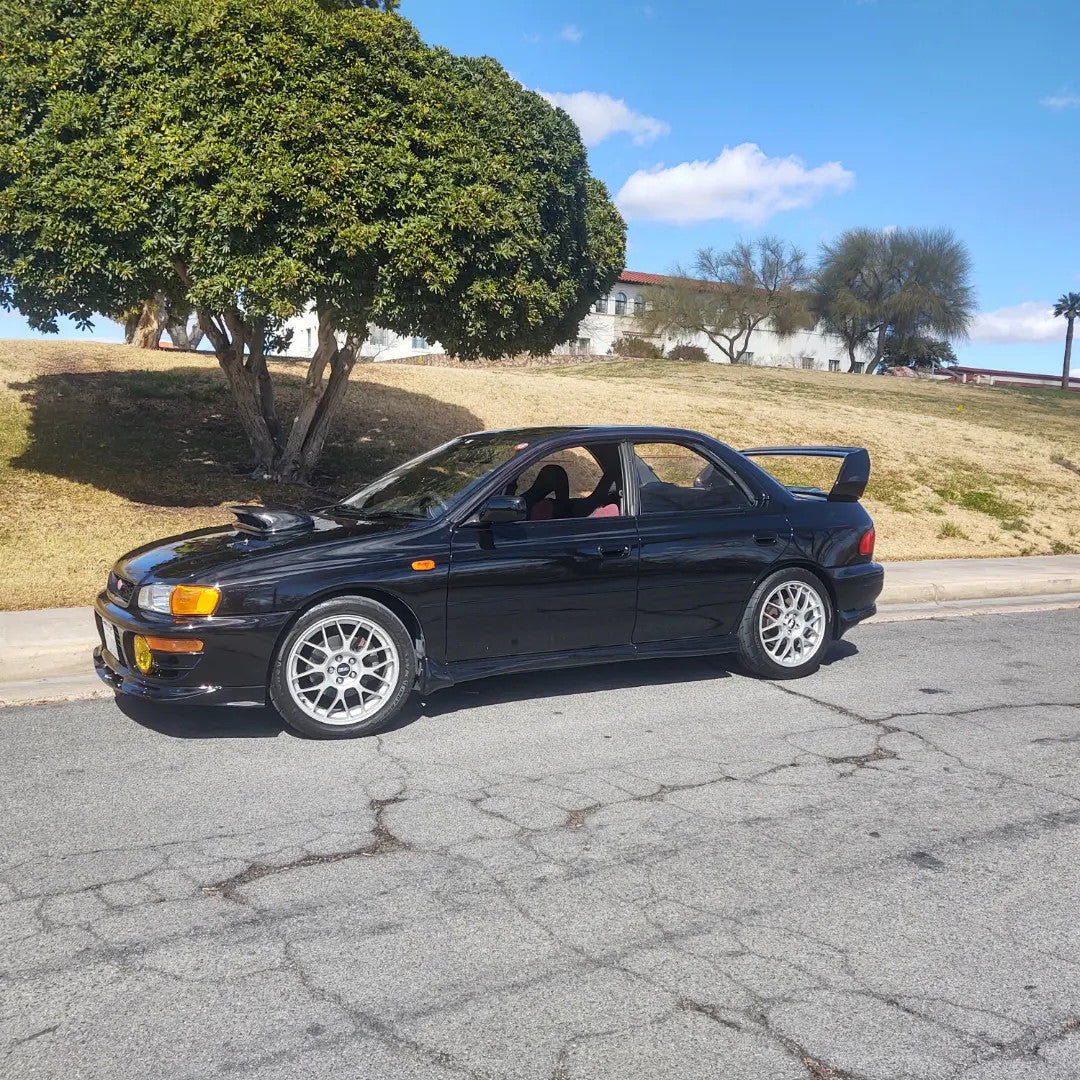Cast Bellmouth Cat-less Downpipe on 99 impreza