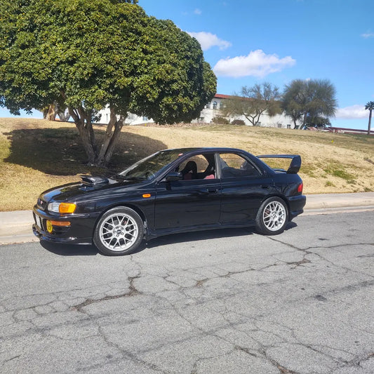Cast Bellmouth Cat-less Downpipe on 99 impreza