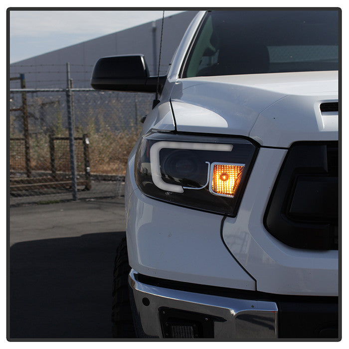 PRO-YD-TTU14-DRL-BK Toyota Tundra 14-21 LED Bar DRL Projector Headlight Black side view ro angle view of one light on